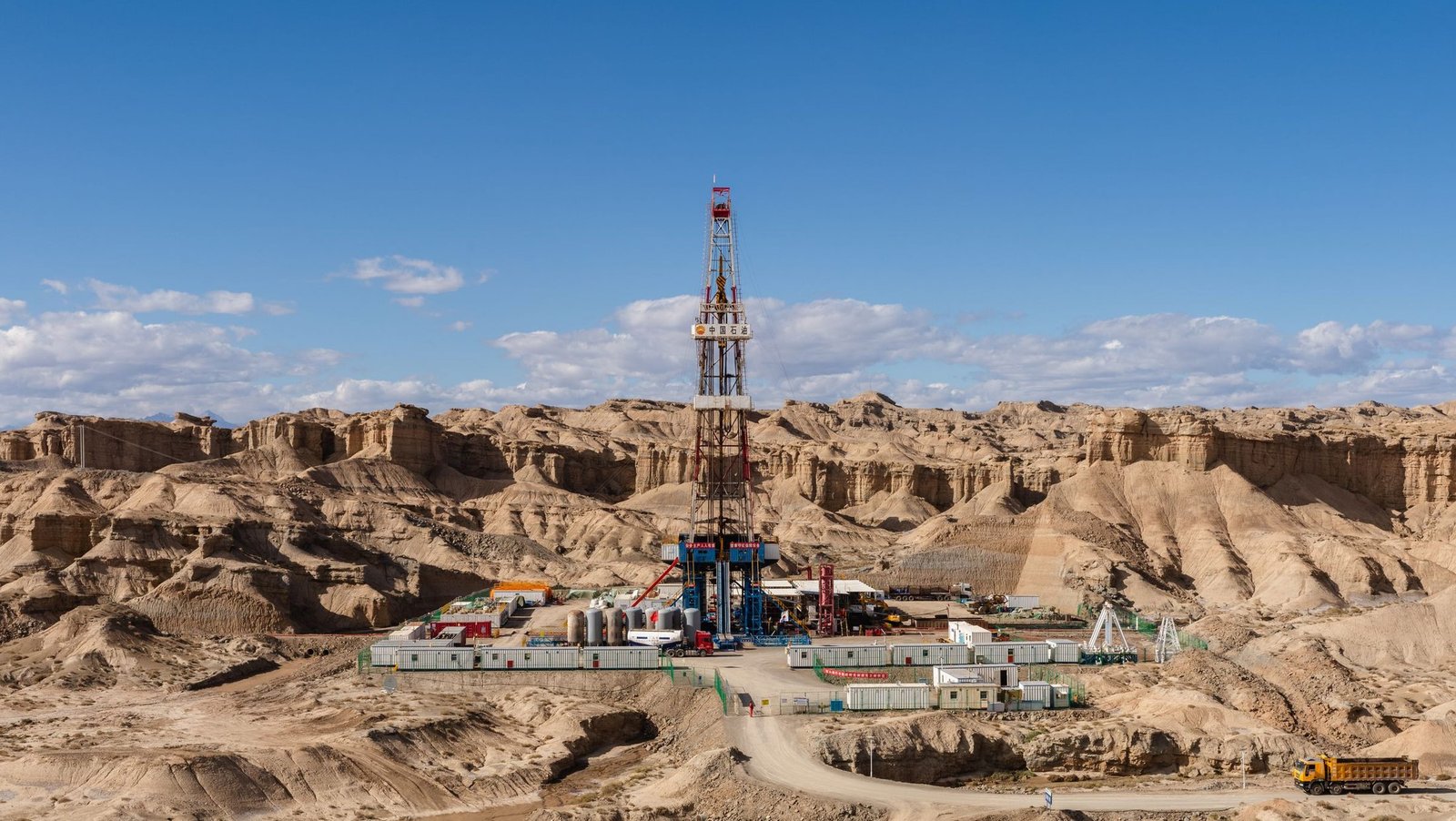 Land drilling rig on site in open desert